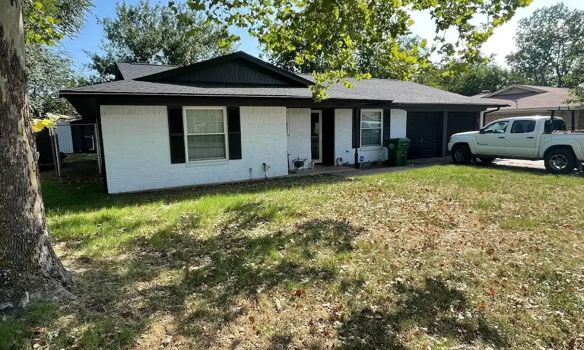 Professional roofing crew working on a residential roof in Hiram